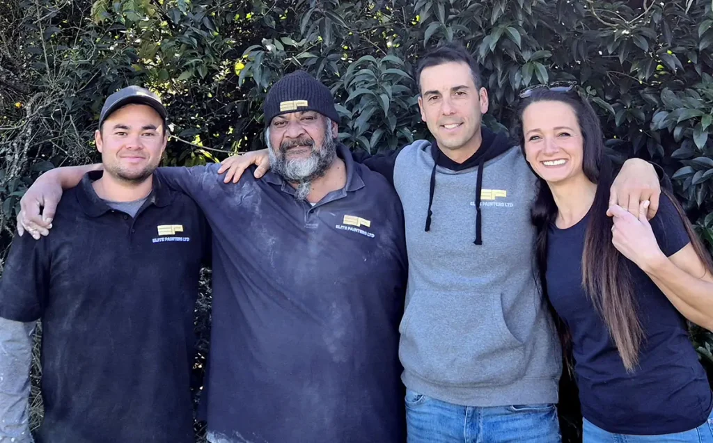 The Elite Painters Ltd team, together in an outdoor setting